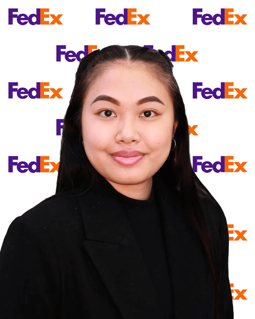 Professional headshot of a woman with glasses smiling